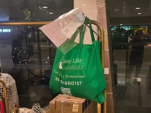 Laundry bag left with the concierge – Easy Life Laundry