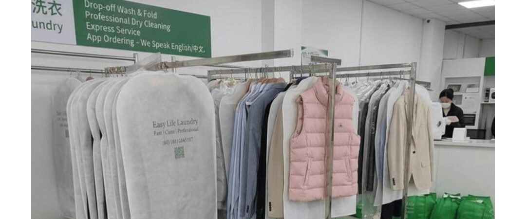 Easy Life Laundry shop with garment bags and folded orders, Guilin